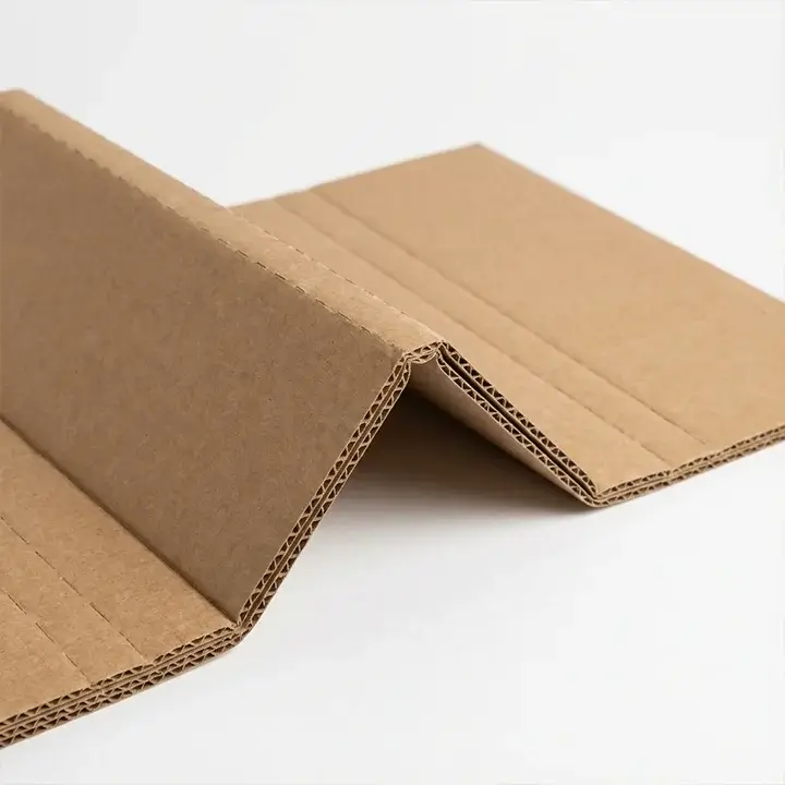 Scored pad inserts for flexible cushioning and box structural support